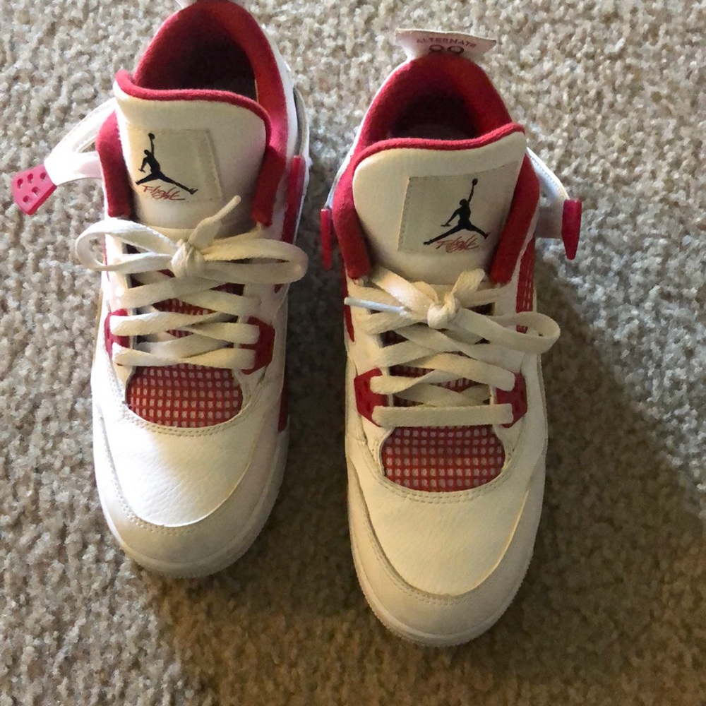 Red and white Jordan 4s